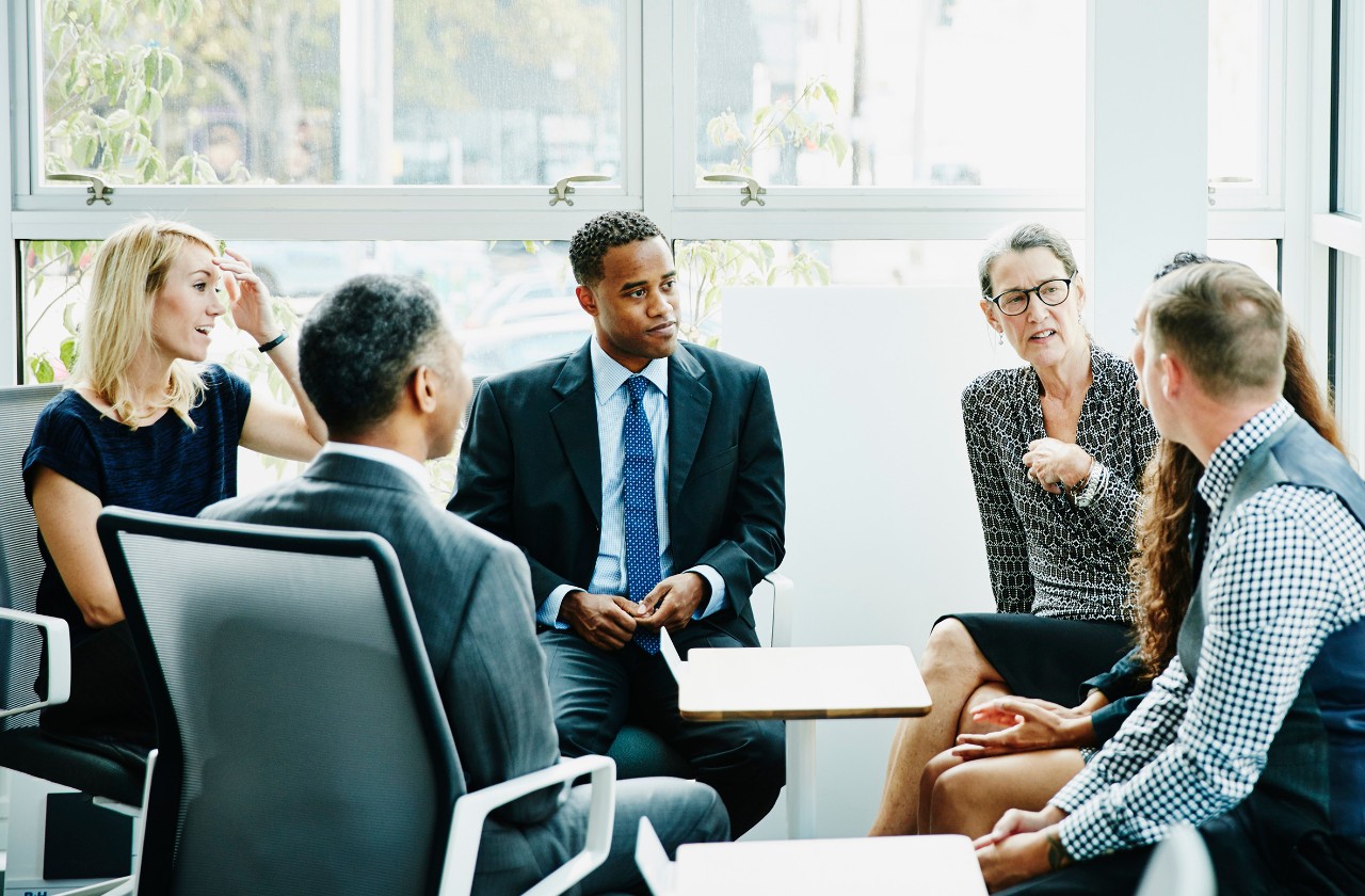 Woman speaking in a team meeting